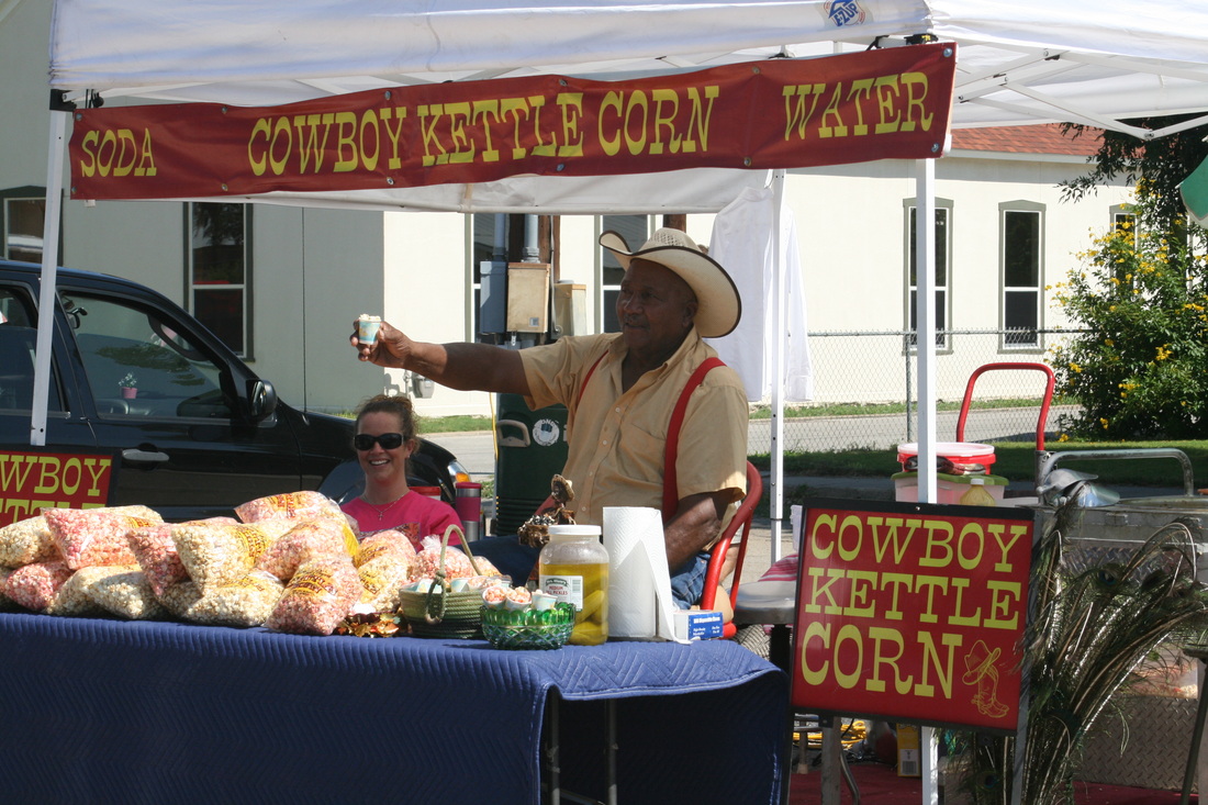 Men selling popcorn at Castroville Market Trail Days Texas Hill Country