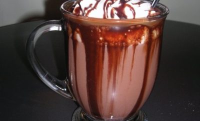Gourmet hot chocolate with homemade whipped cream from The Loft Coffee House
