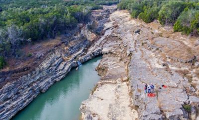 The deep gorge created by the flood showed geologists buried rock of the Hill Country