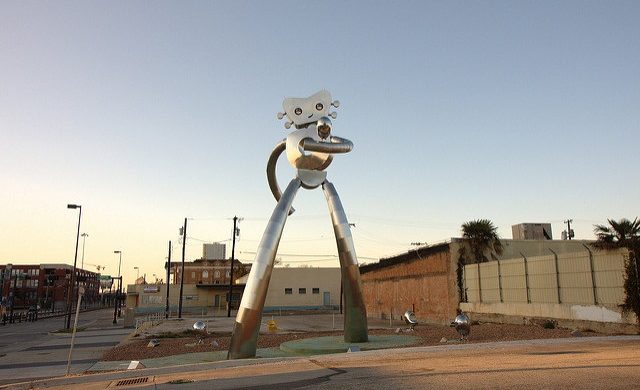 See the Larger than Life Traveling Man: Statues Symbolic of One Texas Neighborhood