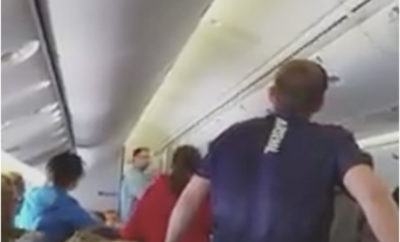 choir singing on plane for solider