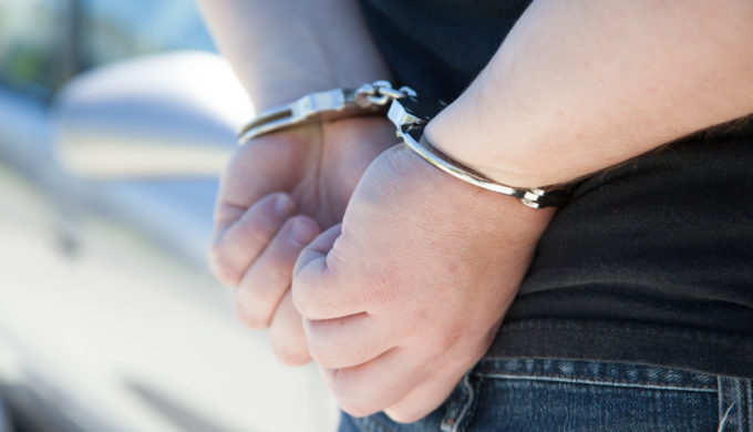 Hands cuffed behind the back Hands cuffed behind the back