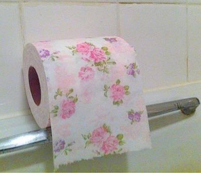 roll pink toilet paper, a roll of pink toilet paper on a white